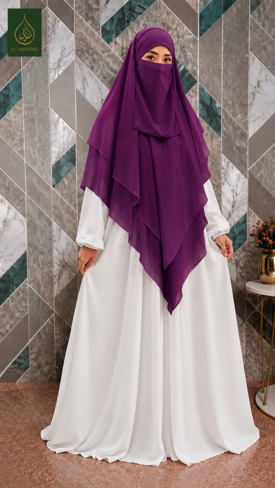 A woman wearing a flowing white abaya dress and a deep purple Abeera Khimar with niqab stands in front of a geometric tiled wall. The image has a green logo in the top-left corner.