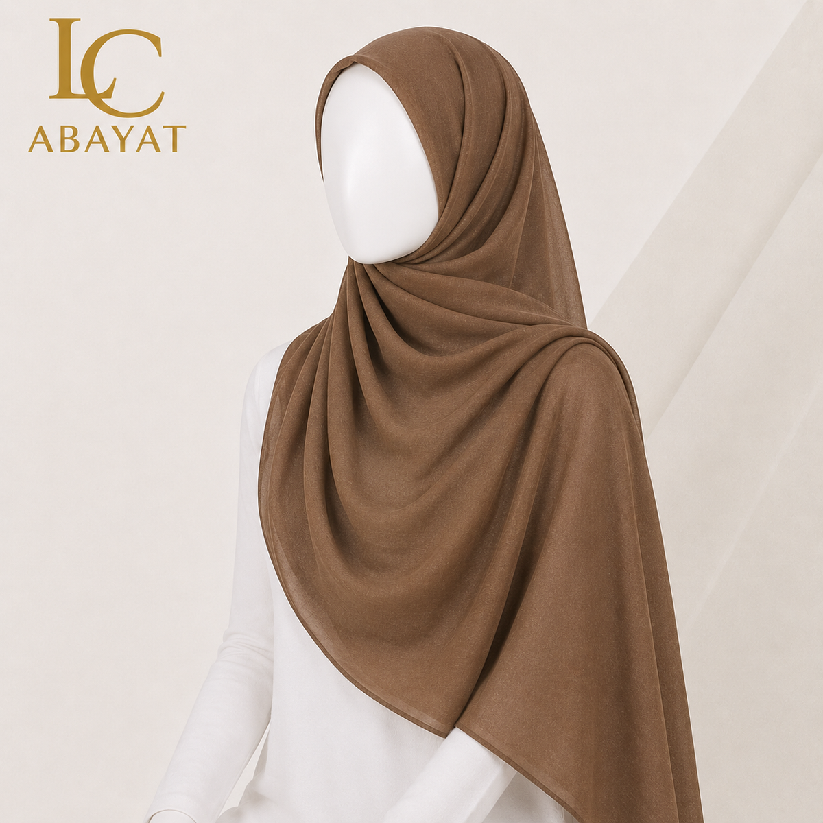 A brown hijab draped elegantly on a white mannequin torso, shown from a side profile against a light beige background with the LC ABAYAT logo in the top left corner.