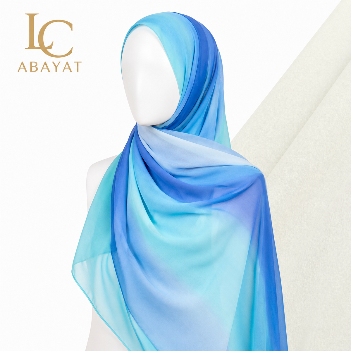 A lightweight sheer hijab scarf with a blue and light blue gradient, draped on a white mannequin head. The Abayat brand logo is visible in the top left corner.