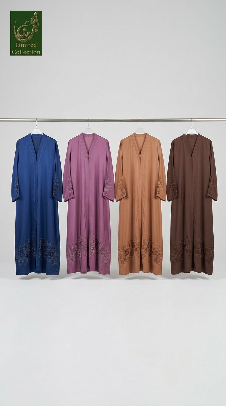 Four long loose abaya dresses hanging on a metal rack against a plain white wall, shown in blue, mauve, tan, and brown. A green Limited Collection logo is visible in the top left corner.