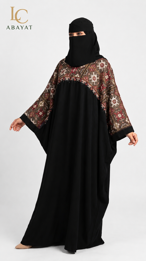 A woman modeling a black abaya with ornate multicolor embroidered sleeves and a matching black face covering, shown against a plain light gray studio background. The LC Abayat logo appears in the top left corner.