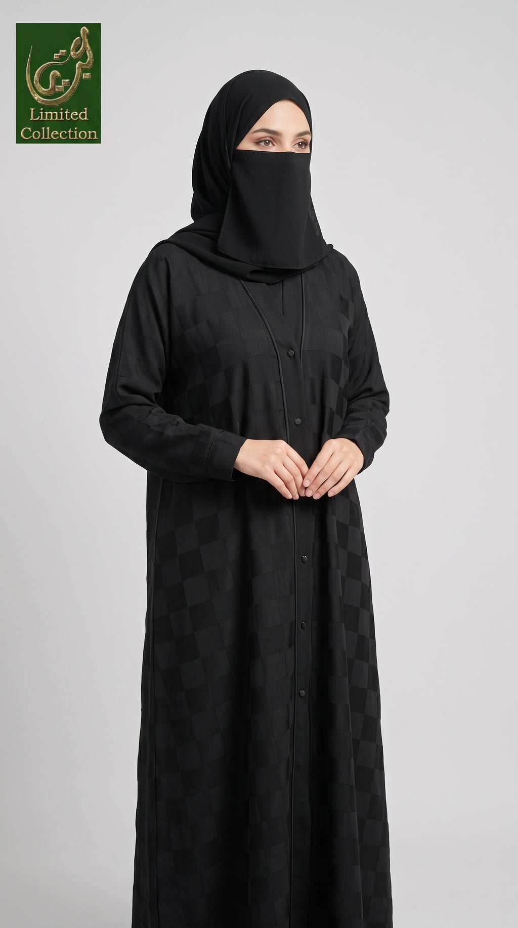 Woman wearing a front-open checkered black jacquard abaya with buttons.