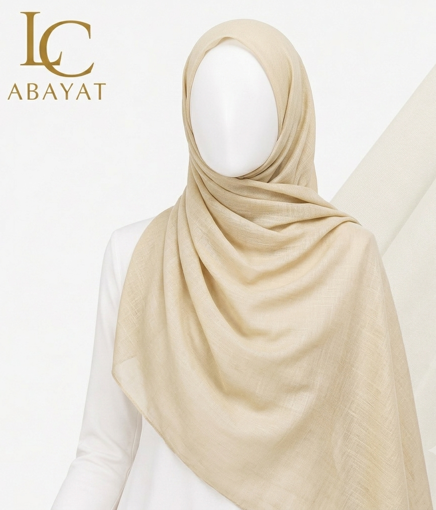 A light beige chiffon hijab draped on a white mannequin torso, with the LC ABAYAT logo in the top-left corner against a clean white background.