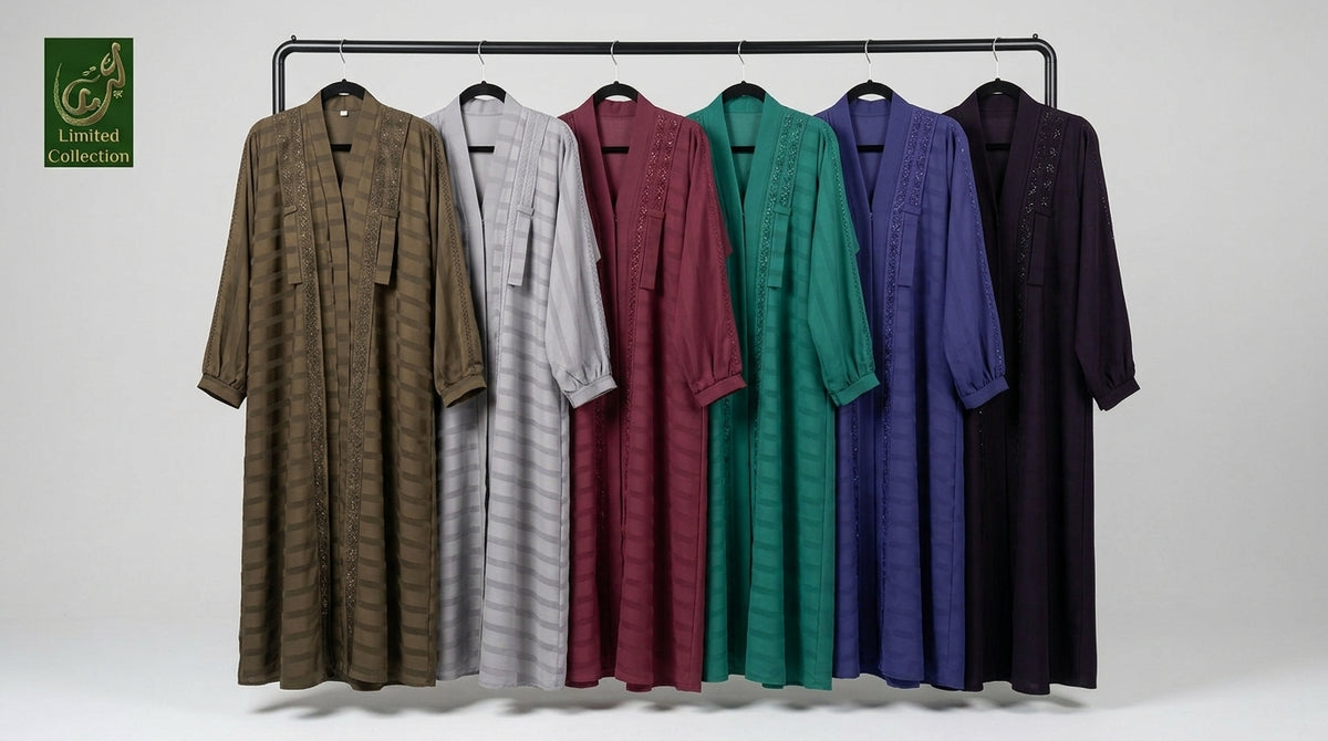 Six long-sleeve Zoom_Self_striped_tie style abayas with stonework in various colors (brown, gray, burgundy, green, blue, and black) are displayed on a black clothing rack against a light gray background. A green 'Limited Collection' logo is visible in the top-left corner.