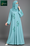 A woman modelling a handmade Cutdana sky blue front-open abaya.