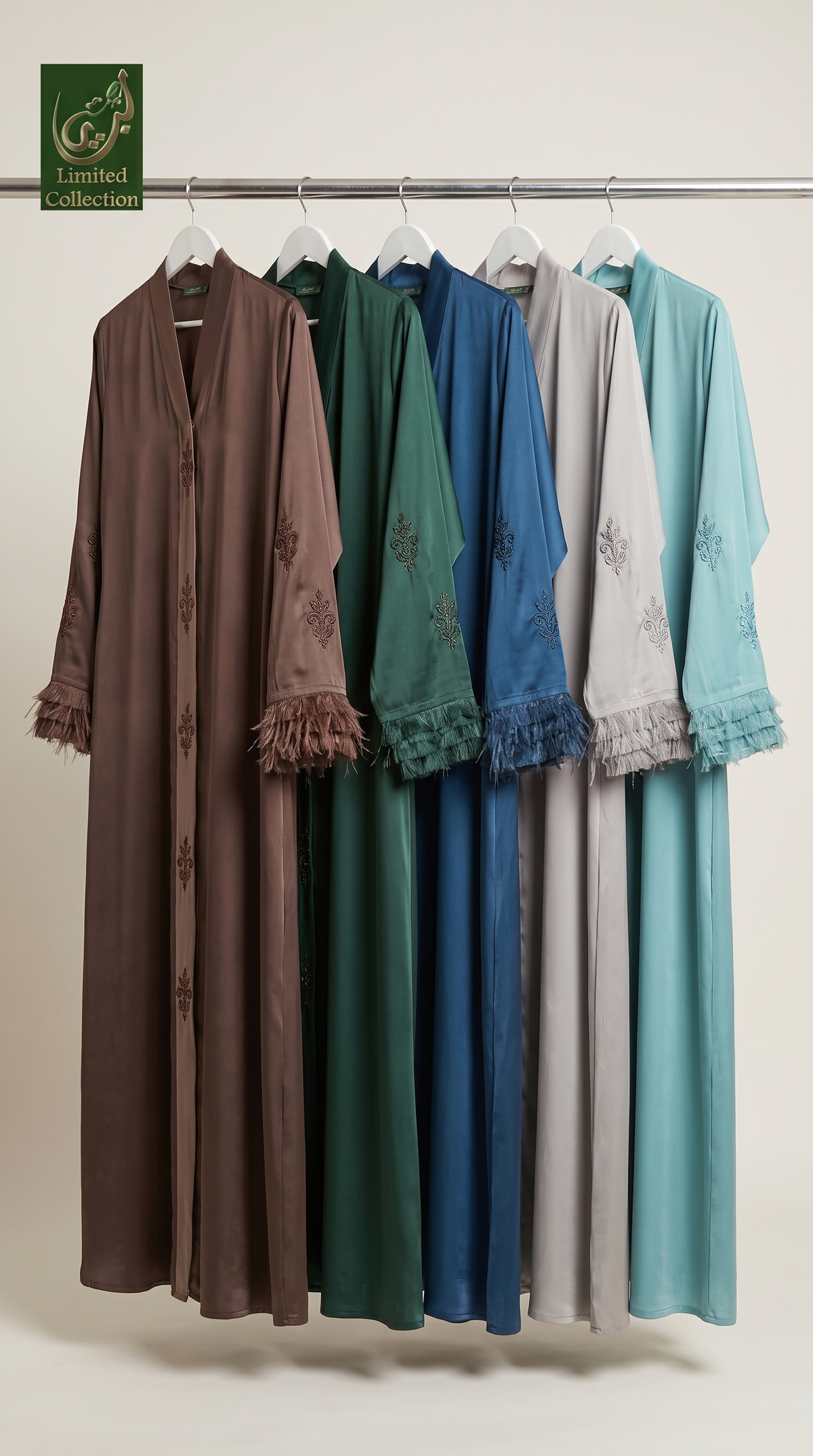 Five long modest garments hanging on a metal rack against a plain light background. The garments are shown in brown, green, blue, light gray, and teal, each with embroidered details and ruffled cuffs.