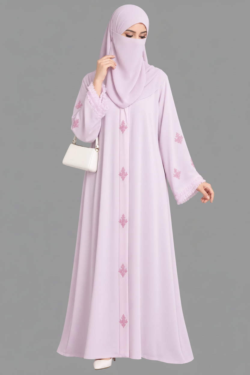 A woman modeling a light lavender cutdana embellishment hanwork modest abaya, including a long abaya with pink floral embroidery, a matching headscarf, and a small white handbag, on a white background with the Abayat Limited Collection brand logo in the top left corner.