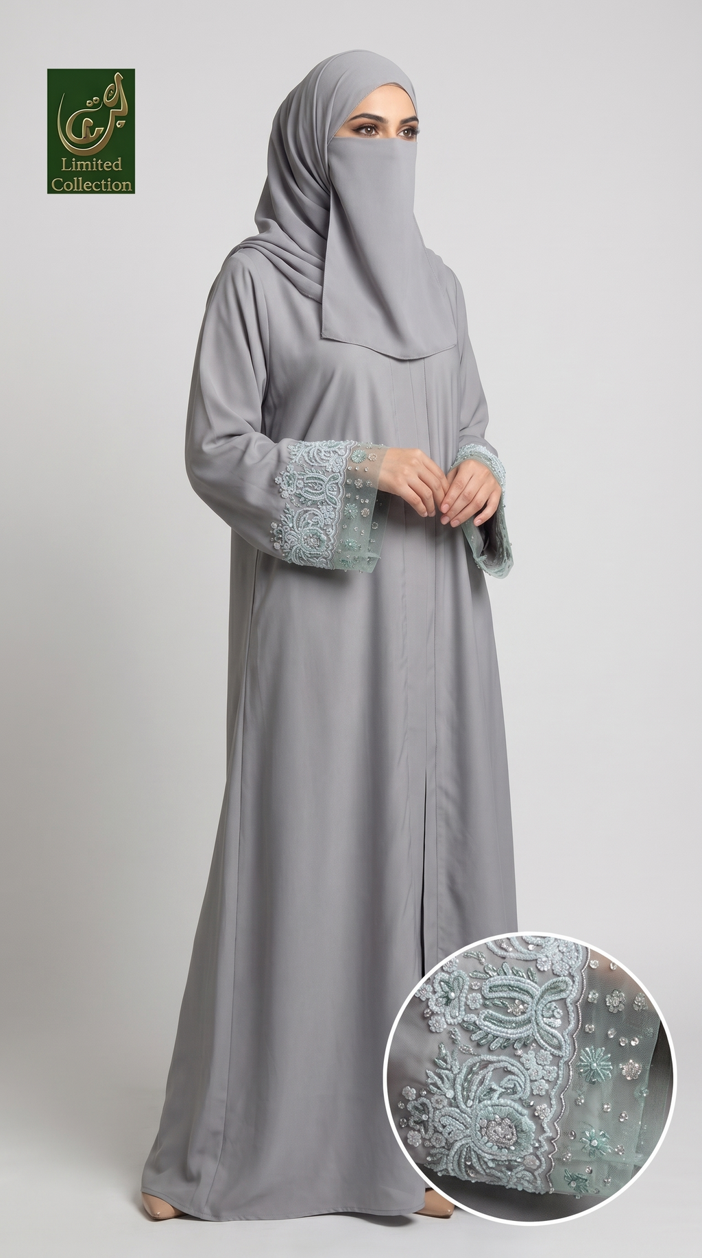A woman modeling a light gray abaya with a matching hijab, featuring light blue embroidered lace cuffs and a small inset circle showing a close-up of the detailed embroidery.
