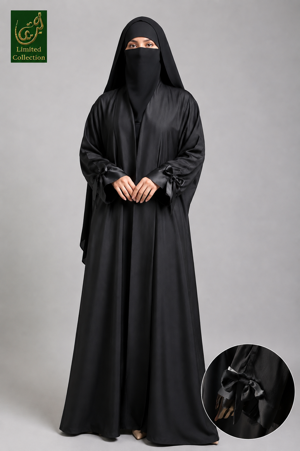 A woman wearing a long black Front-Open Dubai Style Collar Abaya with Bow-Tie Cuffs and a matching black head covering and face veil, standing against a plain gray studio background. A circular inset at the bottom right shows a close-up of a black bow detail on the garment, and a green 'Limited Collection' logo appears in the top left corner.