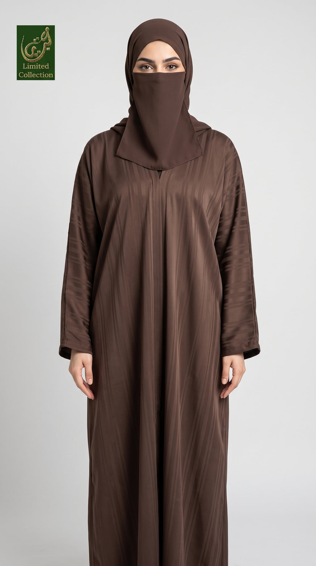 A woman wearing a brown abaya and matching hijab stands against a light gray studio background. A small 'Limited Collection' logo appears in the top-left corner.
