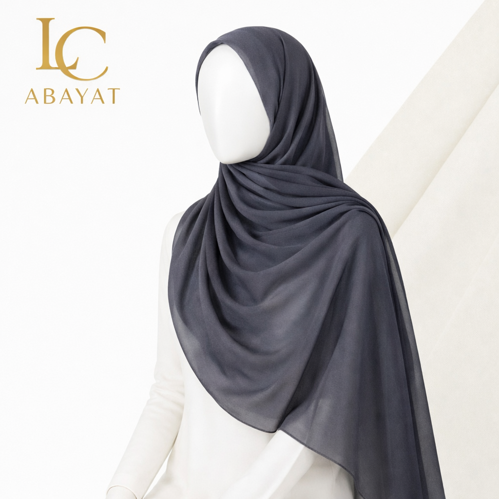 A dark charcoal gray hijab draped elegantly on a white mannequin torso, with the 'LC ABAYAT' logo in gold in the top-left corner.