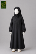 A black long-sleeved abaya dress with embroidered detailing on the chest, styled on a mannequin kid with a matching black hijab, white gloves, and white shoes against a solid gray background. A 'Limited Collection' logo is visible in the top-left corner.