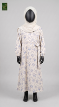 A long-sleeve modest abaya with a blue floral print on a cream base, styled on a black mannequin with a cream hijab. The image is set against a solid light gray background.