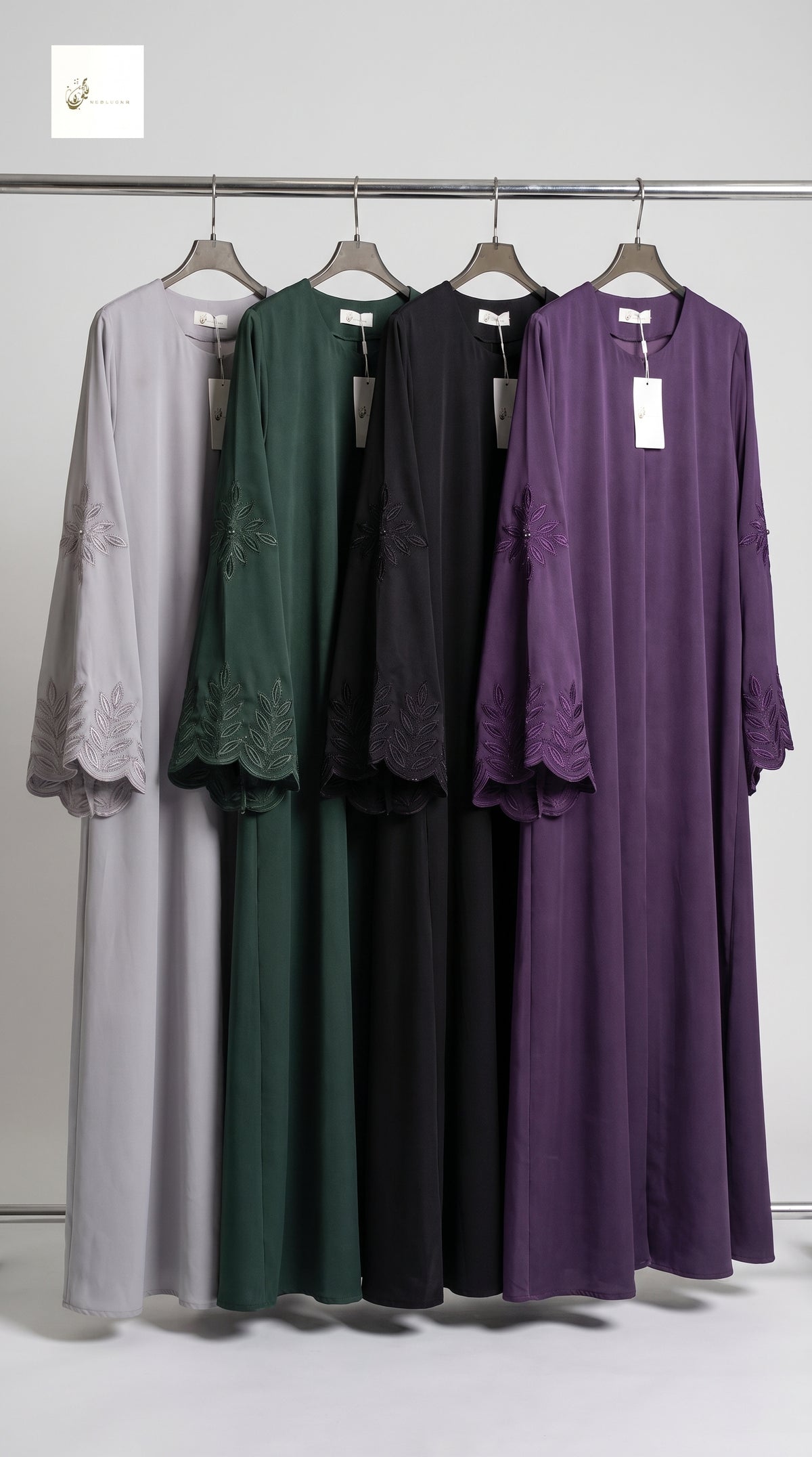 Front-closed long flared maxi abaya with floral stonework and embroidery available in 5 colors (Purple, Black, Olive Green, Taupe, and Mauve Purple)