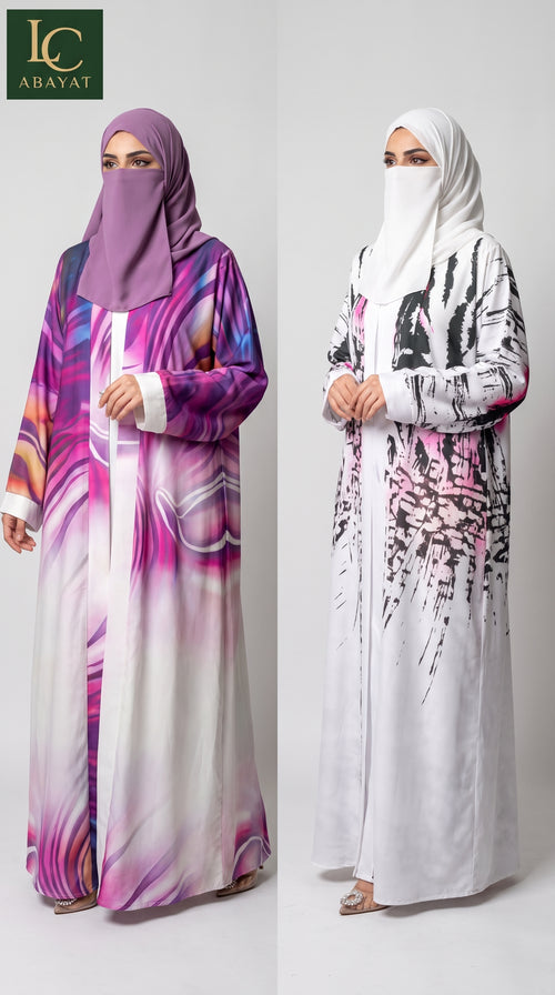 Two women modeling long abayas with head coverings against a light gray studio background. The left abaya is purple, pink, and white with a marbled abstract print.
