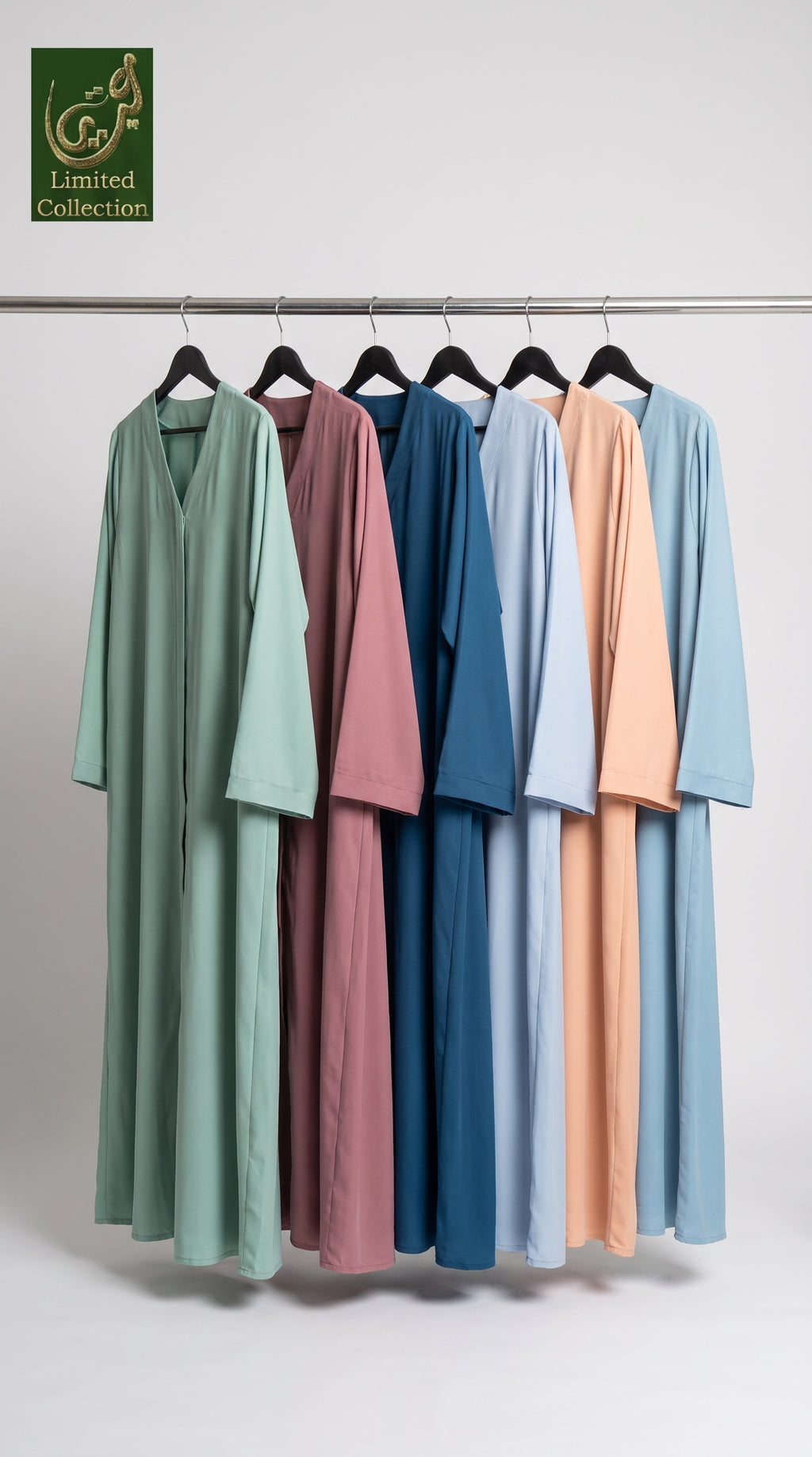 Six long loose-fitting plain nida abayas hanging on black hangers from a metal rod, shown in mint green, dusty rose, dark blue, light blue, peach, and sky blue. A green 'Limited Collection' logo appears in the top-left corner against a plain light gray studio background.