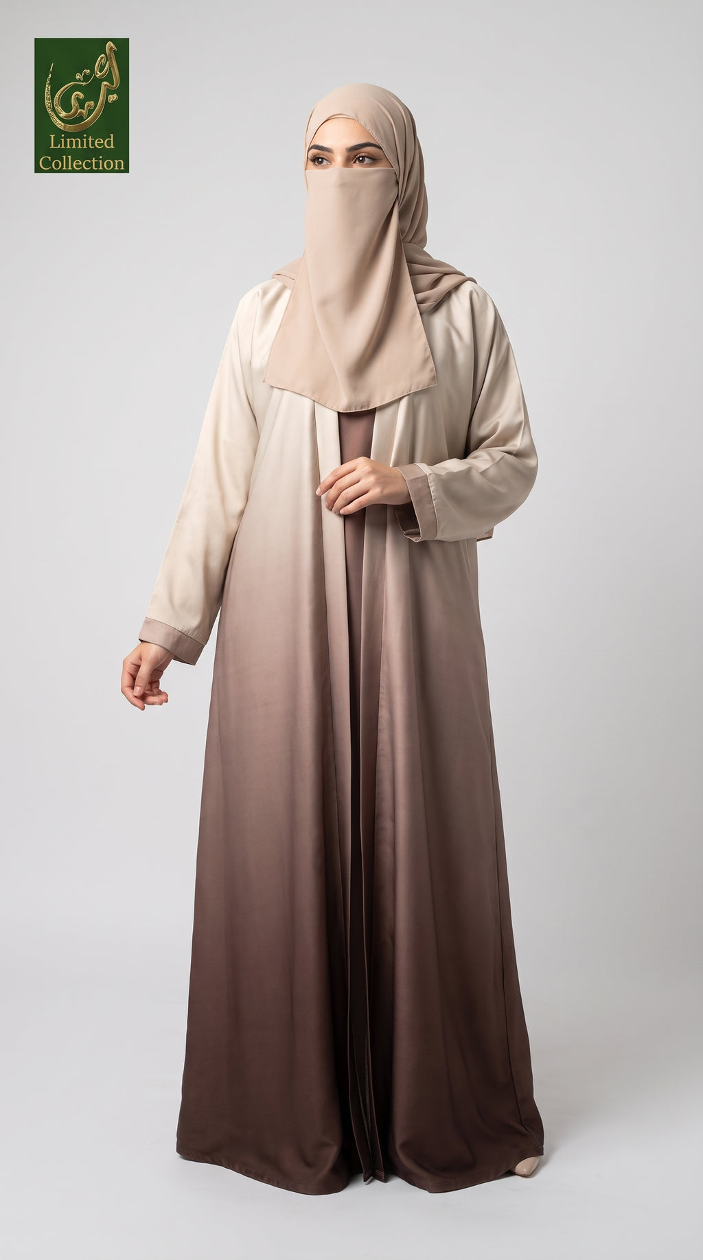 A woman modeling a modest long abaya dress with a matching hijab, featuring a smooth gradient from light beige at the top to deep brown at the bottom, set against a plain light gray background.