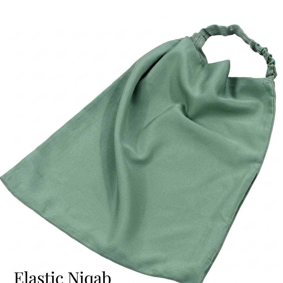 A sage green elastic niqab headscarf shown on a plain white background with text overlay at the bottom left.