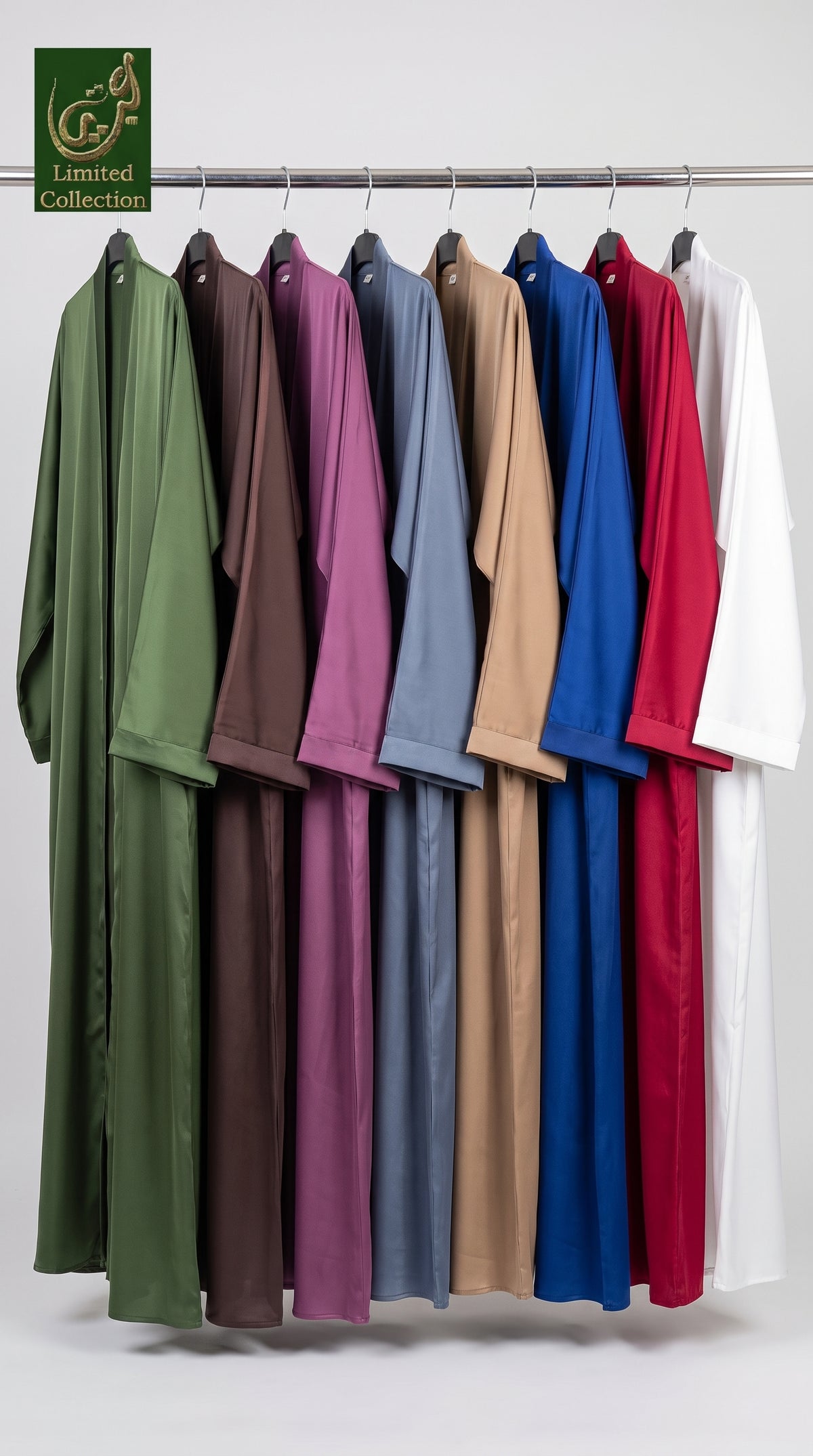 A set of long-sleeved, loose-fitting plain basic nida abayas in multiple colors (olive green, brown, purple, slate blue, tan, royal blue, red, and white) hanging on a metal rack against a light gray background. A 'G&F Limited Collection' logo is visible in the top left corner.