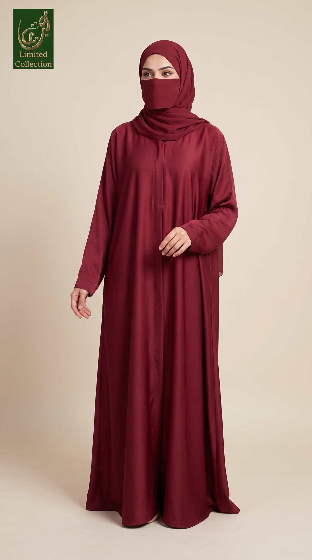 A woman modeling a long maroon abaya dress with a matching hijab, standing against a solid beige studio background. A green 'Limited Collection' logo is visible in the top-left corner.