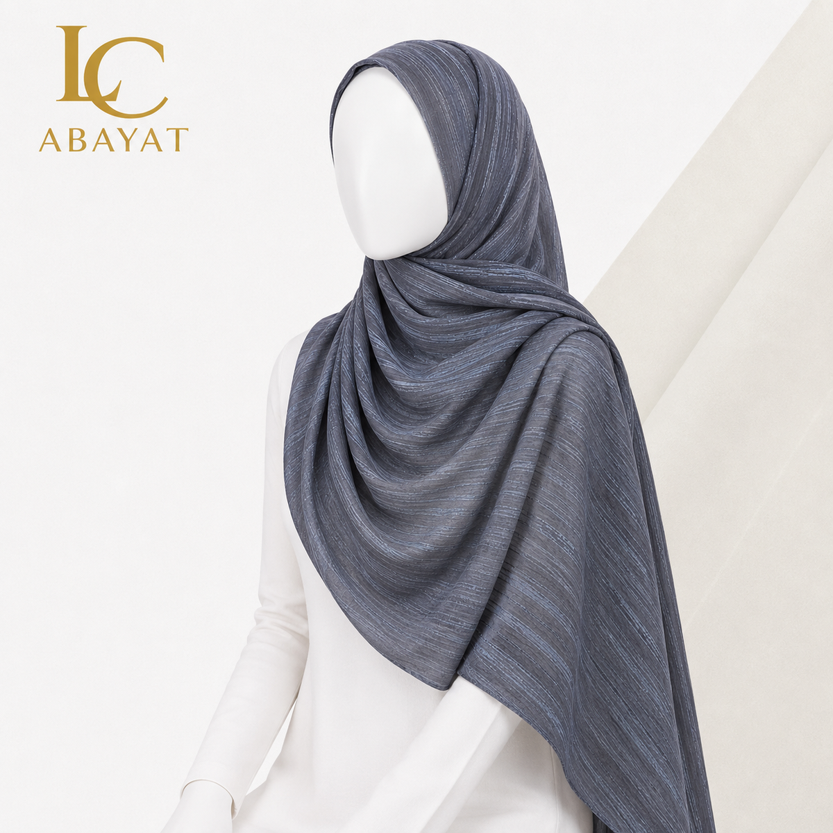 A mannequin wearing a beautiful silver grey hijab.