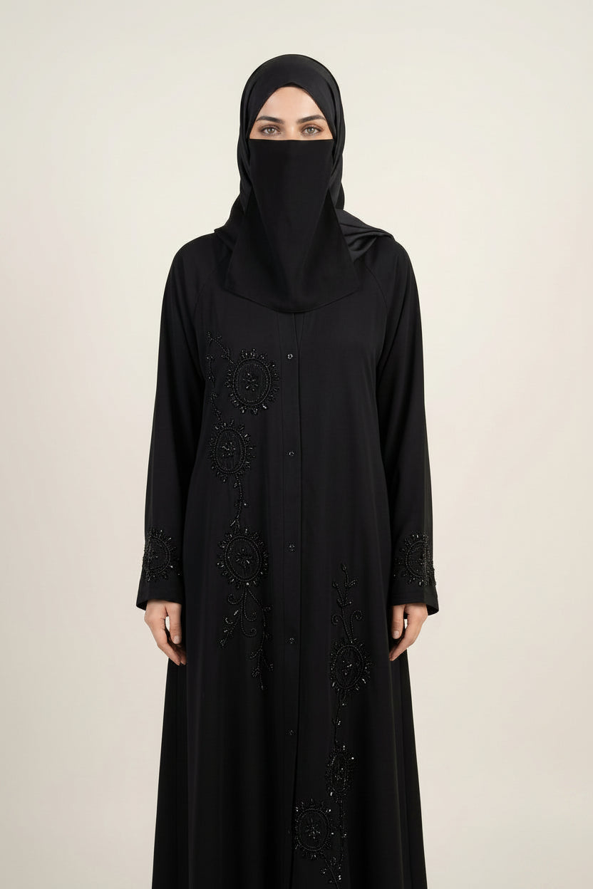 This is a handwork cutdana black abaya worn by a beautiful woman.