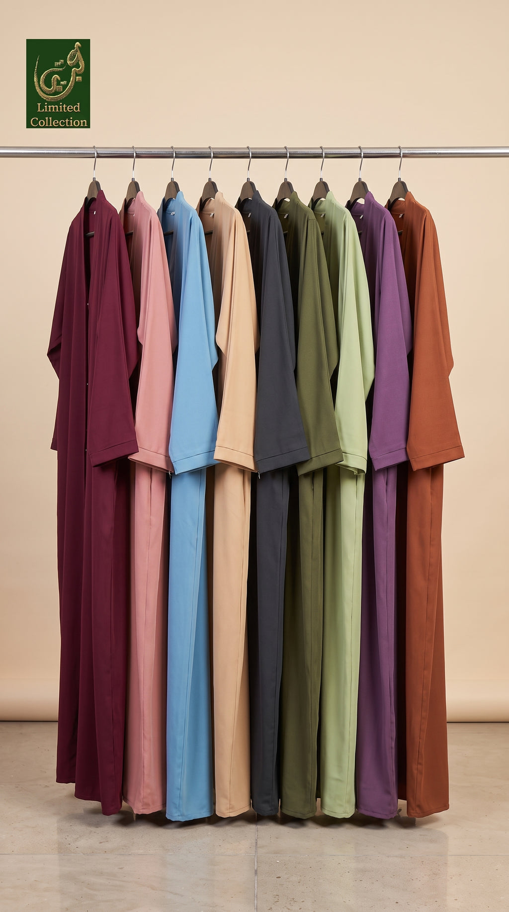 A set of long-sleeve linen-blend abayas open front in multiple earthy and pastel colors, hanging on a metal rack against a beige wall. The colors include burgundy, dusty pink, light blue, charcoal, tan, olive green, sage green, purple, and terracotta.